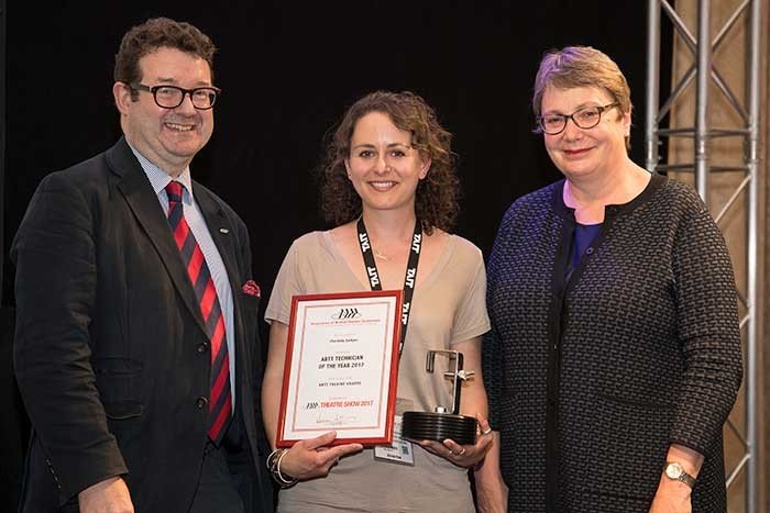 student Charlotte Lockyer is presented with a certificate and trophy for Technician of the Year