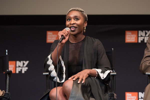RADA graduate Cynthia Erivo holding microphone taking part in a press conference
