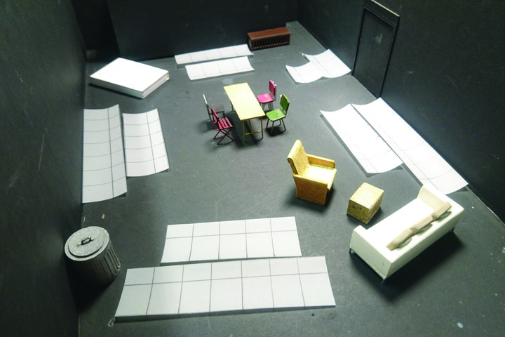 Model box of the set design for RADA's production of Cathy showing a scale model of furniture, props and scenic art