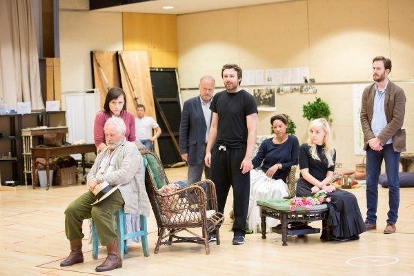 group of actors in rehearsal studio for Platanov including James McArdle standing at the centre