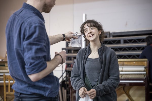 Patsy Ferran in rehearsal for Summer and Smoke in a studio with piano on back wall.