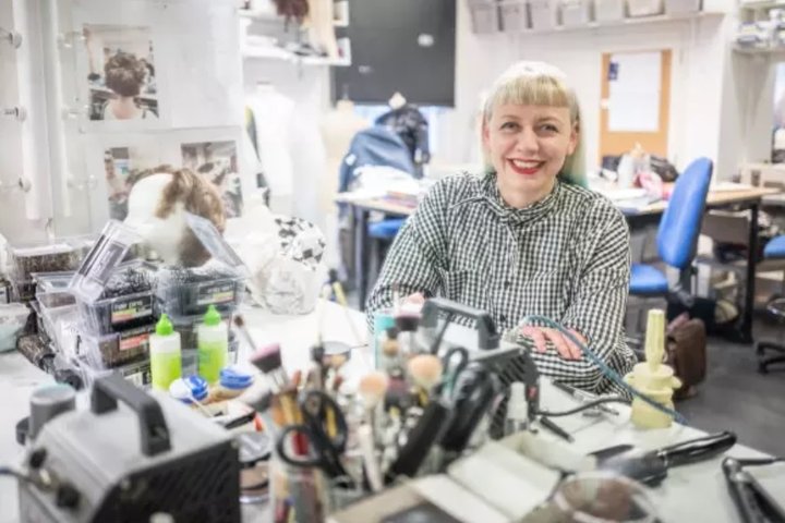 Reny Morsch sits in costume workshop