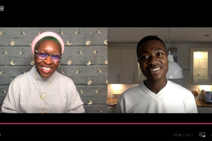 A screenshot from BBC iPlayer. The split screen shows actress Cynthia Erivo, left and student Daniel Bowerbank, right. They are both smiling widely.